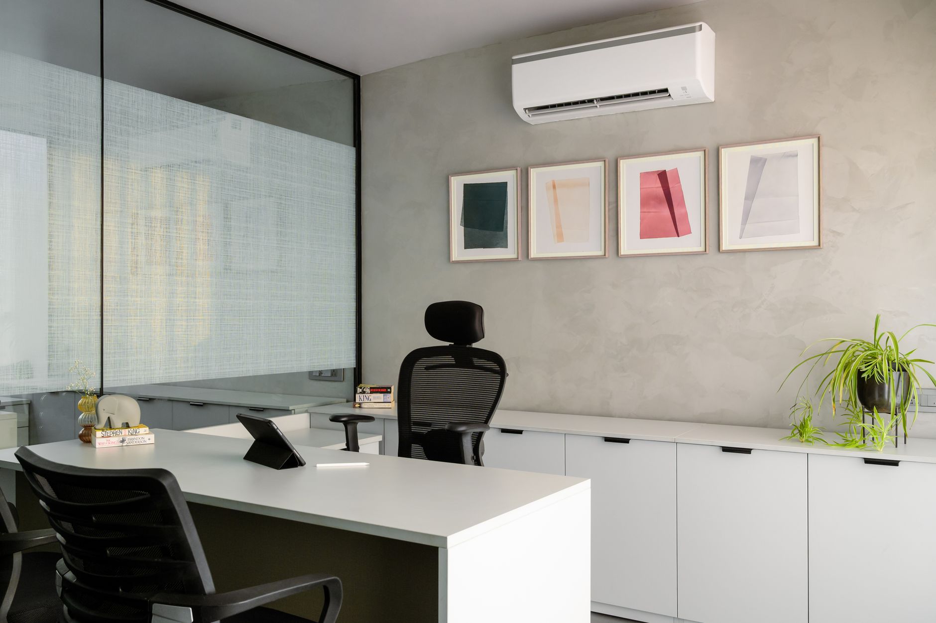 Contemporary office space with a sleek desk and modern decor, perfect for a professional setting.