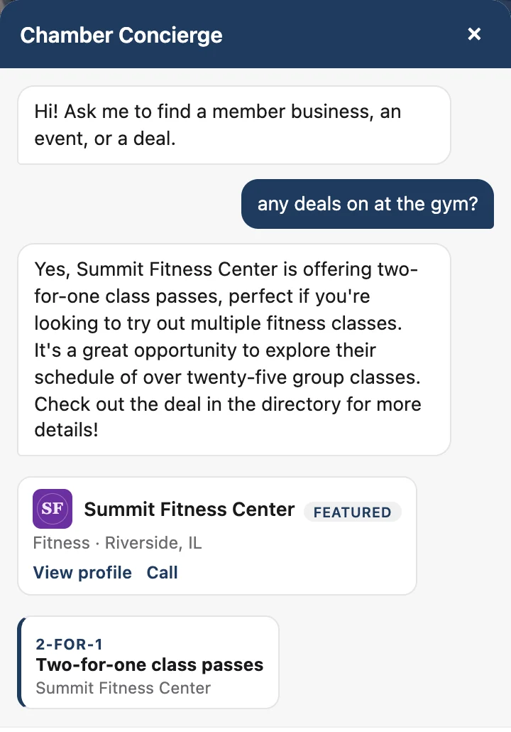 A visitor asks the chamber AI concierge whether there are any deals on at the gym; it answers with Summit Fitness Center's two-for-one class passes and shows a tappable offer card.