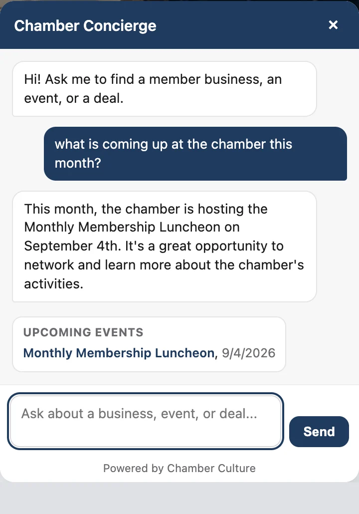 The chamber AI concierge answering what is coming up at the chamber this month and listing an upcoming membership luncheon with its date.